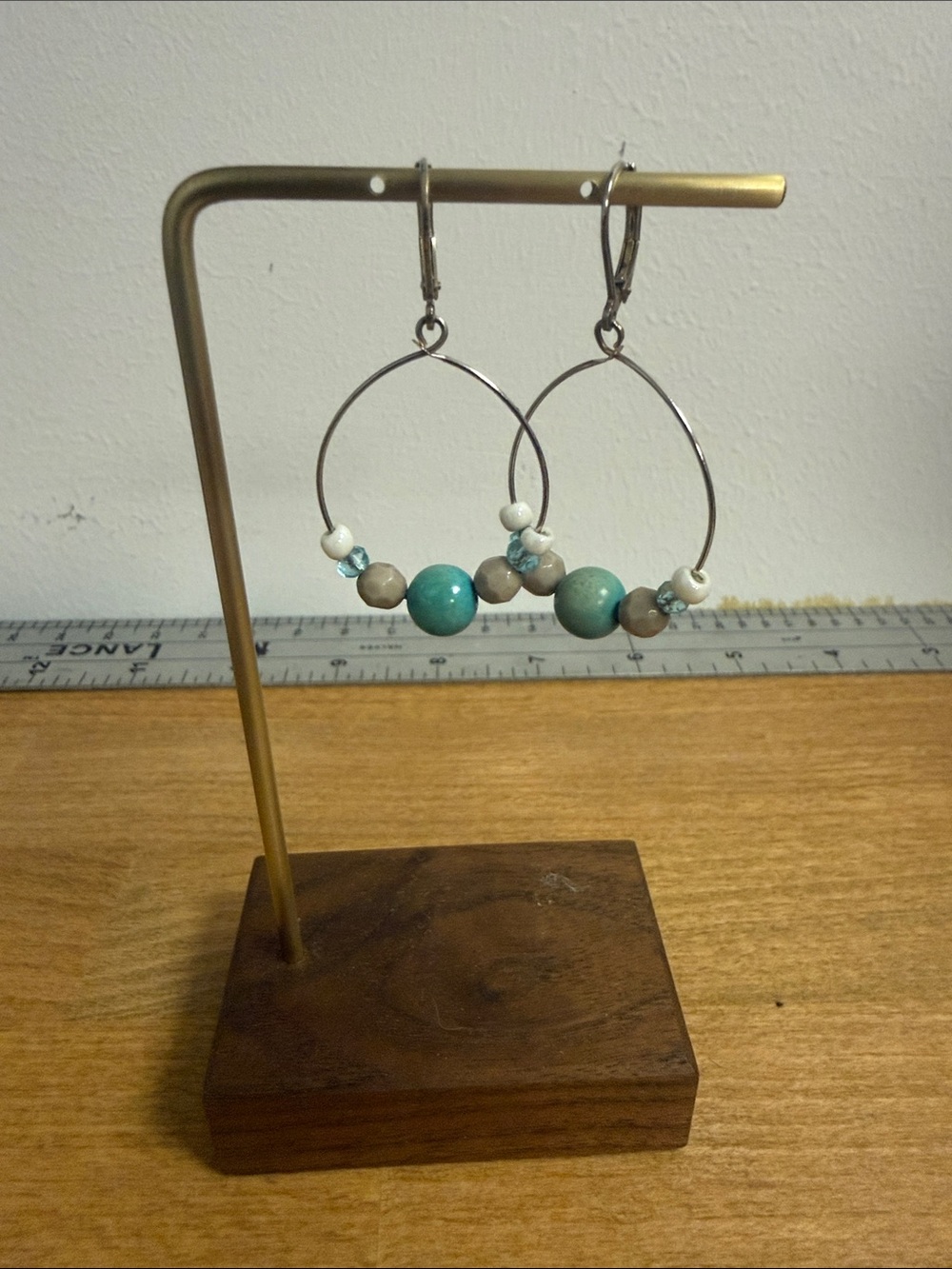 Silver tone wire rim circle dangle drop earrings with faux turquoise beads